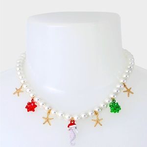 NWT Betsey Johnson necklace adorned with charms seahorse, starfish & bows